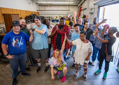 A large group shot of participants and donation pickup employees and OKFD