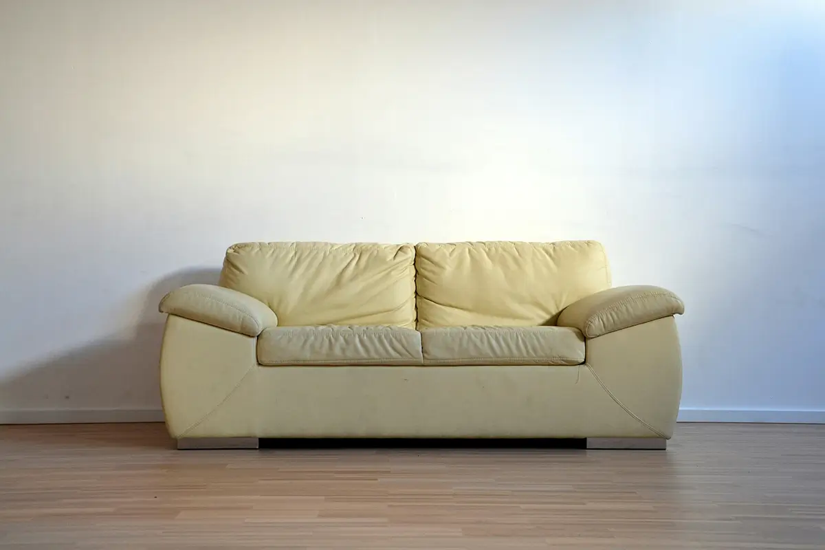 A cream colored yellow couch